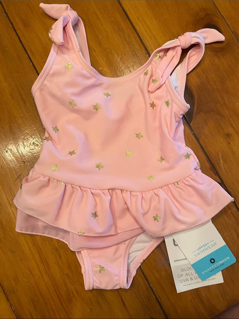 Snapper Rock Pink One-Piece Swimsuit with Gold Stars and Ruffle